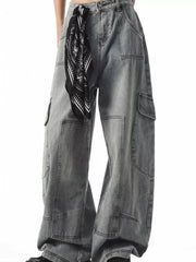 Relaxed fit grey cargo jeans with spacious pockets and a black bandana tied at the waist.