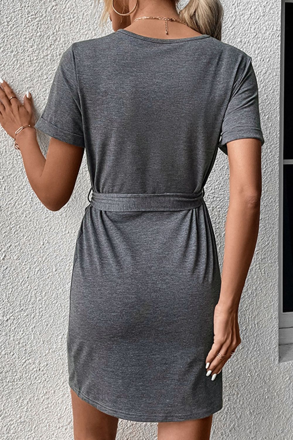 Dark gray short sleeve tee dress with tie waist and button detail