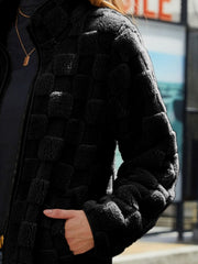 Black textured grid zip-up jacket with a mock neck and fuzzy material.