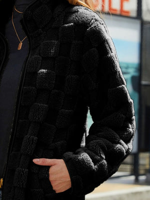 Black textured grid zip-up jacket with a mock neck and fuzzy material.