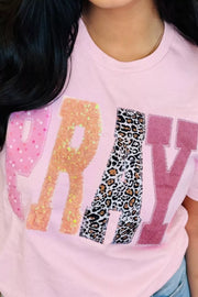 Pink cotton t-shirt with sequin and leopard print PRAY graphic patch detail.