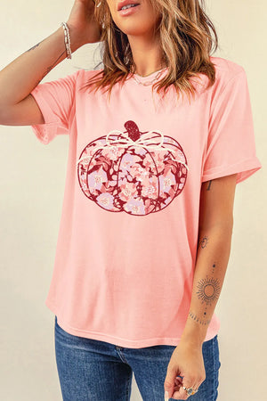 Blush pink t-shirt with a floral pumpkin graphic and bow detail.