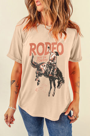 Tan graphic t-shirt with a rodeo cowboy riding a bucking bronco and "RODEO RIDE 'EM COWBOY" text.