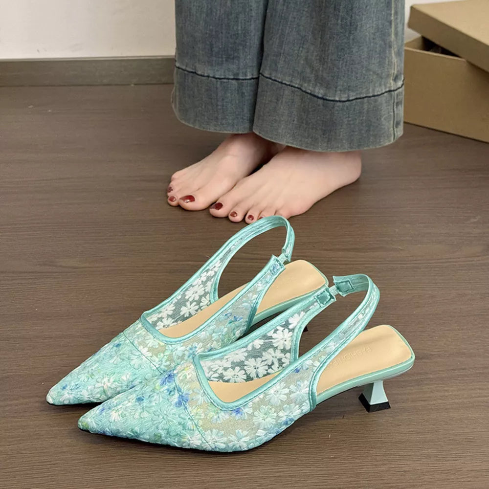 Elegant lace slingback kitten heels in mint green with floral pattern and adjustable ankle strap.