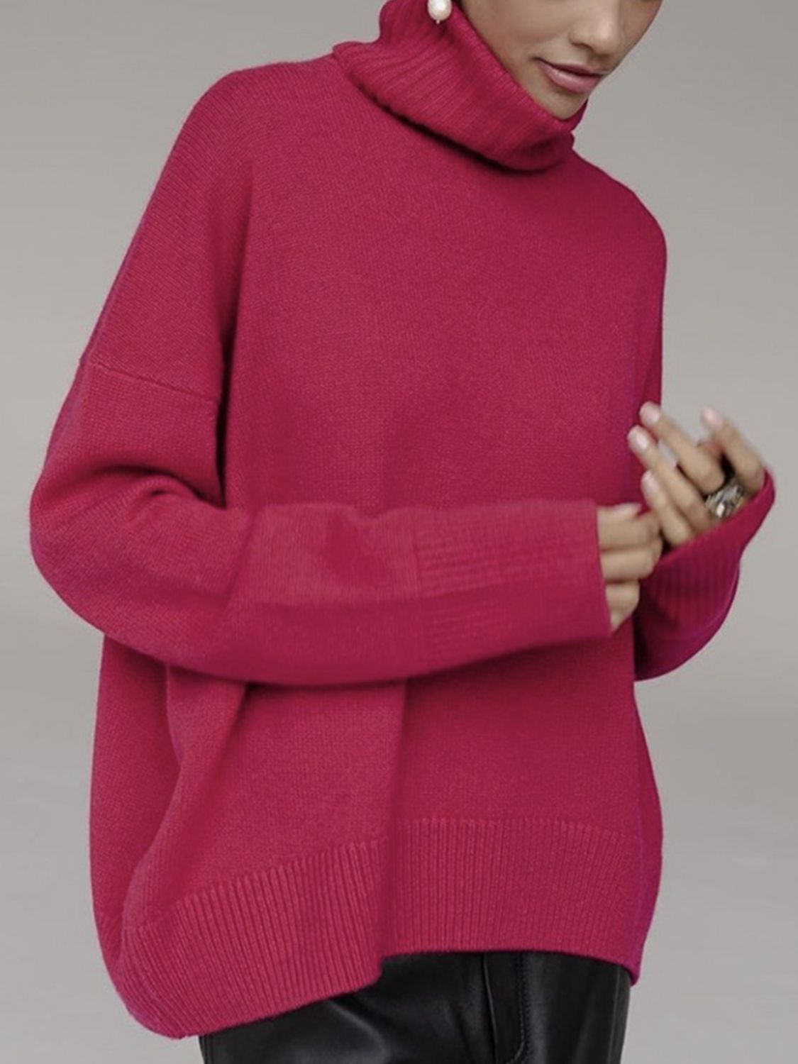 Cerise ribbed turtleneck knit sweater with relaxed fit and ribbed cuffs.