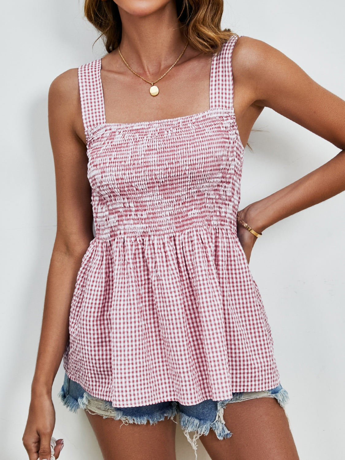Smocked gingham peplum tank top in deep red with square neckline and wide straps.