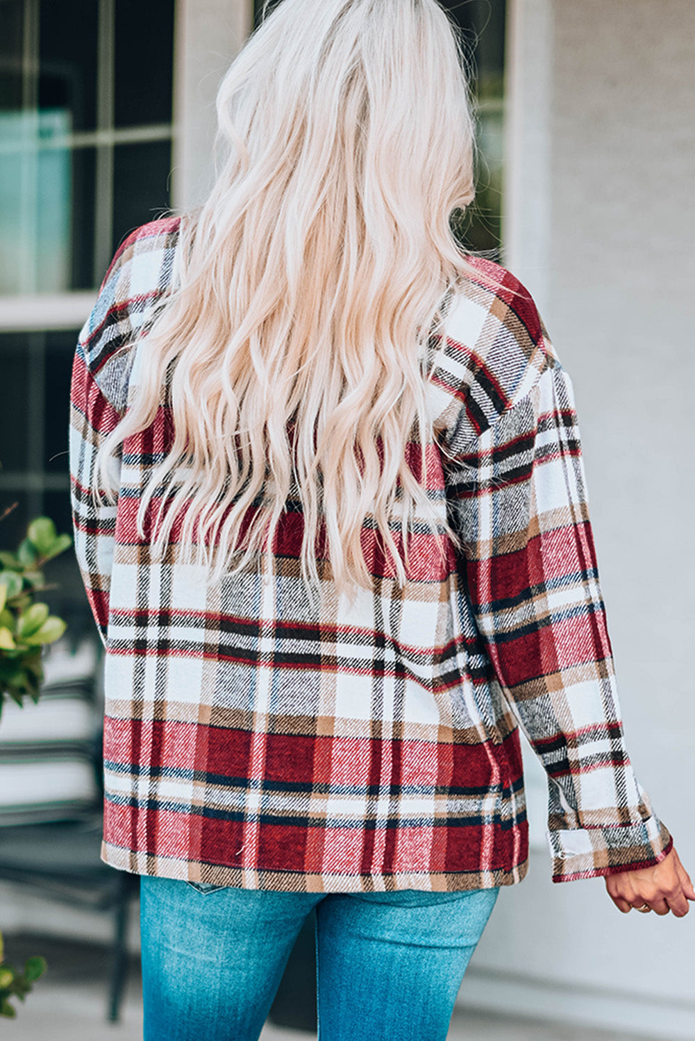 Soft plaid shacket with patch pockets in red and blue tones.