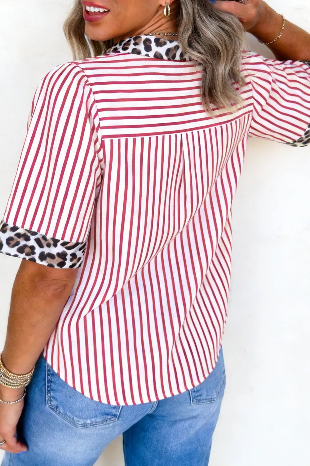 Red and white striped shirt with leopard print collar and cuffs.