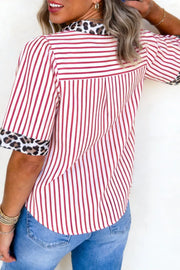 Red and white striped shirt with leopard print collar and cuffs.