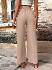 Khaki linen palazzo trousers with drawstring waist and wide leg.