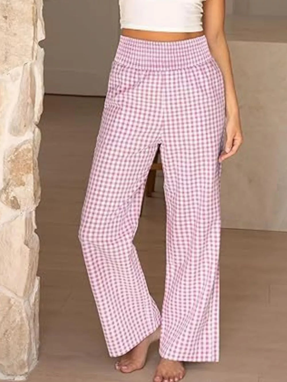 Pink plaid maternity pants with smocked waistband and wide legs.
