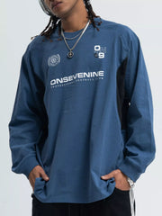 Relaxed fit royal blue long-sleeve tee with contrast stitching and graphic print.