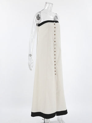 Beige cotton blend tube maxi dress with button front and black trim detail.