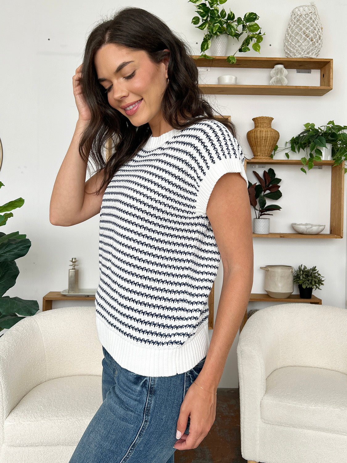 Sleeveless knit tank top with navy and white stripes, crew neck, and ribbed hem.