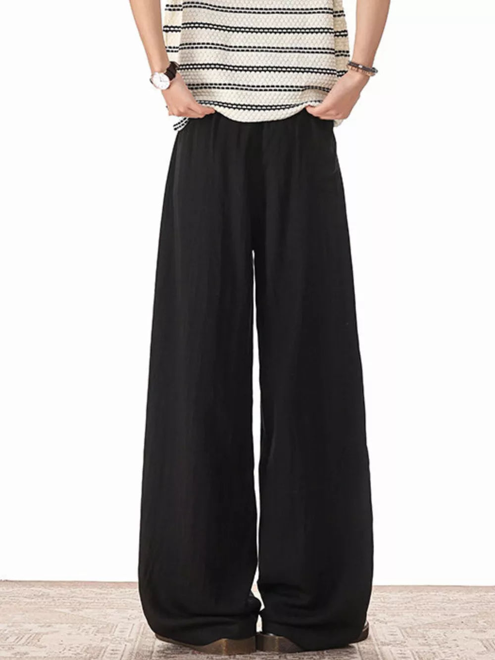 Black relaxed fit plus size drawstring sweatpants with wide legs.