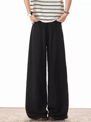 Black relaxed fit plus size drawstring sweatpants with wide legs.