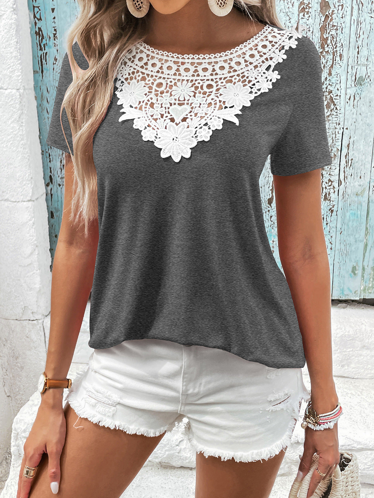 Dark gray t-shirt with white floral lace yoke and short sleeves.