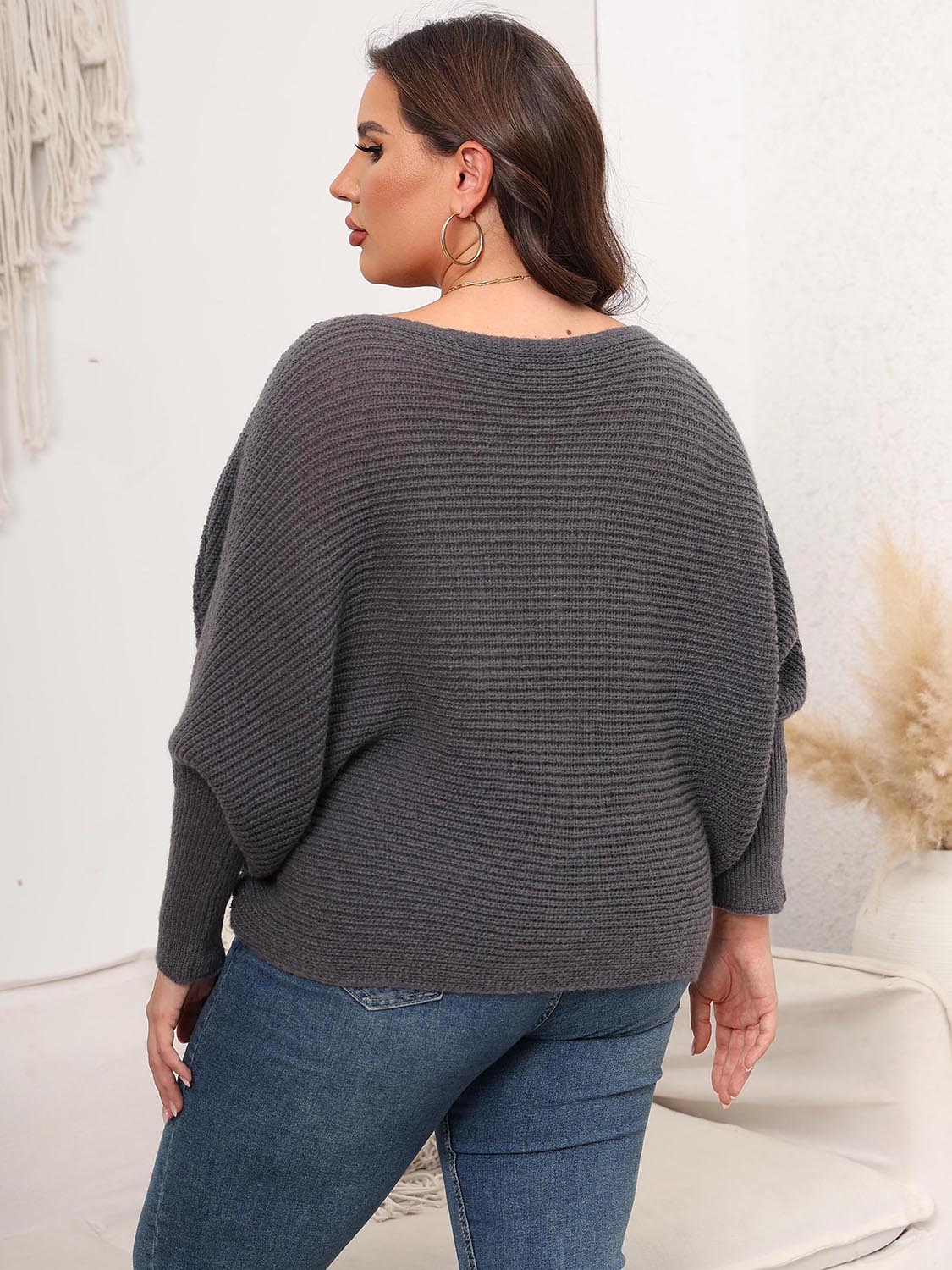Charcoal ribbed knit cocoon sweater with batwing sleeves and boatneck.