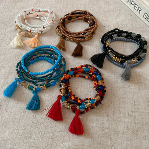 Beaded tassel stacked bracelet sets in white, coffee brown, royal blue, black, and multi-color.