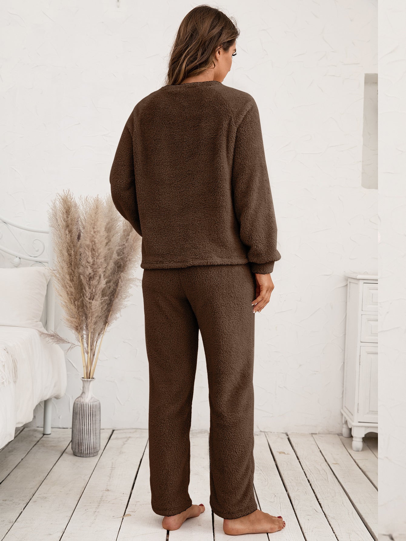 Plush loungewear set in chocolate brown, featuring a crewneck sweatshirt with raglan sleeves and matching relaxed-fit pants.
