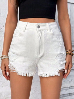 White denim shorts with distressed details and frayed hem