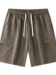 Men's relaxed fit cargo shorts in Khaki with drawstring waist and multiple pockets.