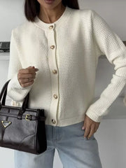 White textured knit cardigan with gold button detail and crew neck.