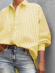Light yellow striped oversized button-down shirt with a pocket and cuffed sleeves.