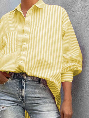 Light yellow striped oversized button-down shirt with a pocket and cuffed sleeves.