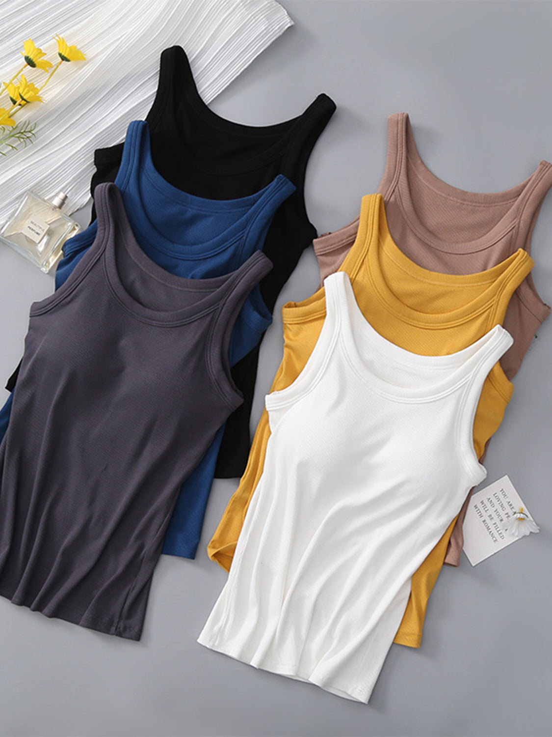 Ribbed knit tank tops in dark gray, dark blue, black, khaki, mustard, and white.