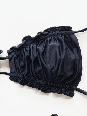 Black ruffle tie bikini top with ruched detail and tie straps.