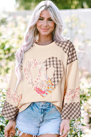 Patchwork heart raglan top in tan with plaid and floral sleeves and heart detail.