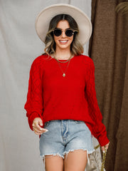 Red diamond-cut raglan knit sweater with textured sleeves.