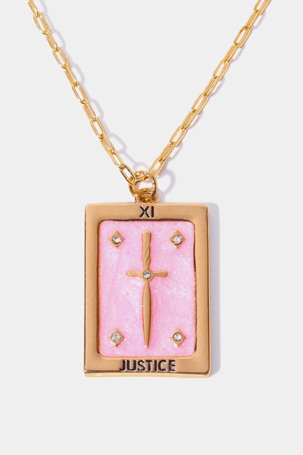 Tarot card pendant necklace in blush pink with sword and gems, gold chain.