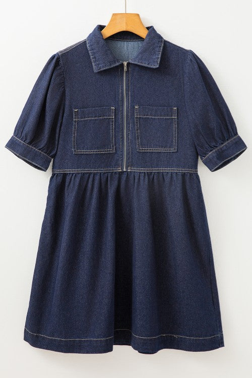 Dark denim mini dress with puff sleeves, zip front, and chest pockets.