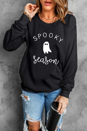 Black crewneck sweatshirt with white ghost and text graphic, casual long sleeve top