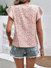 Pale blush floral flutter sleeve blouse with a mixed floral print.