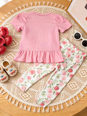 Pink ruffle top with puff sleeves and floral print leggings for baby girls.