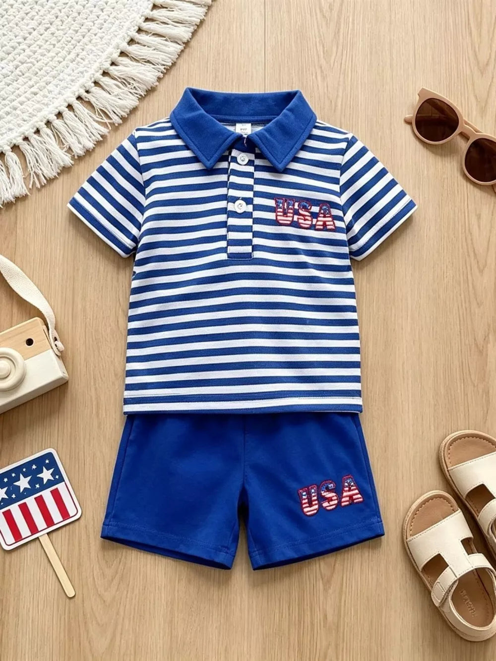 Baby blue and white striped polo with USA embroidery and matching blue shorts.