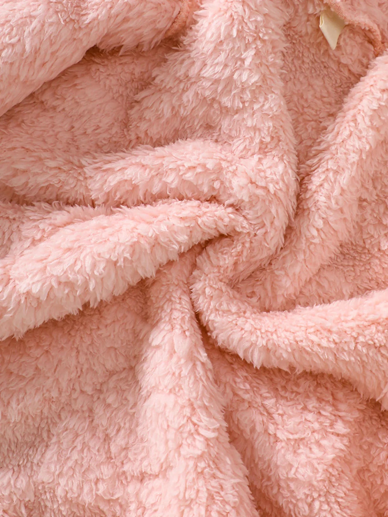 Dusty pink fuzzy hooded jacket detail showing soft plush texture