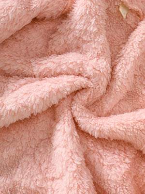 Dusty pink fuzzy hooded jacket detail showing soft plush texture
