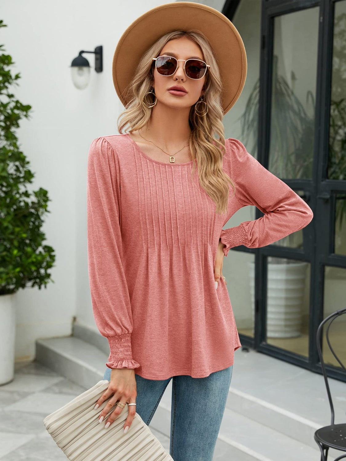 Pleated bodice gathered sleeve top in Burnt Coral with round neckline and smocked cuffs.