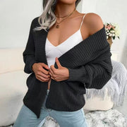 Black chunky knit dolman sleeve cardigan with ribbed texture and open front.