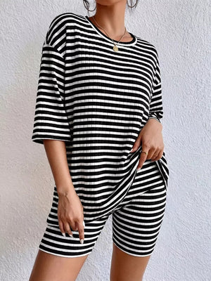 Chic striped two-piece set in black stripes with elbow sleeve top and biker shorts.