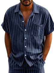 Navy blue striped cotton camp collar shirt with button-down front and chest pocket.