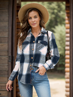 Checked plaid button-down overshirt with chest pockets and a collared neckline.