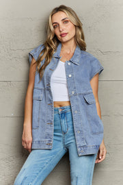 Light wash denim utility vest with oversized pockets and collared neckline.