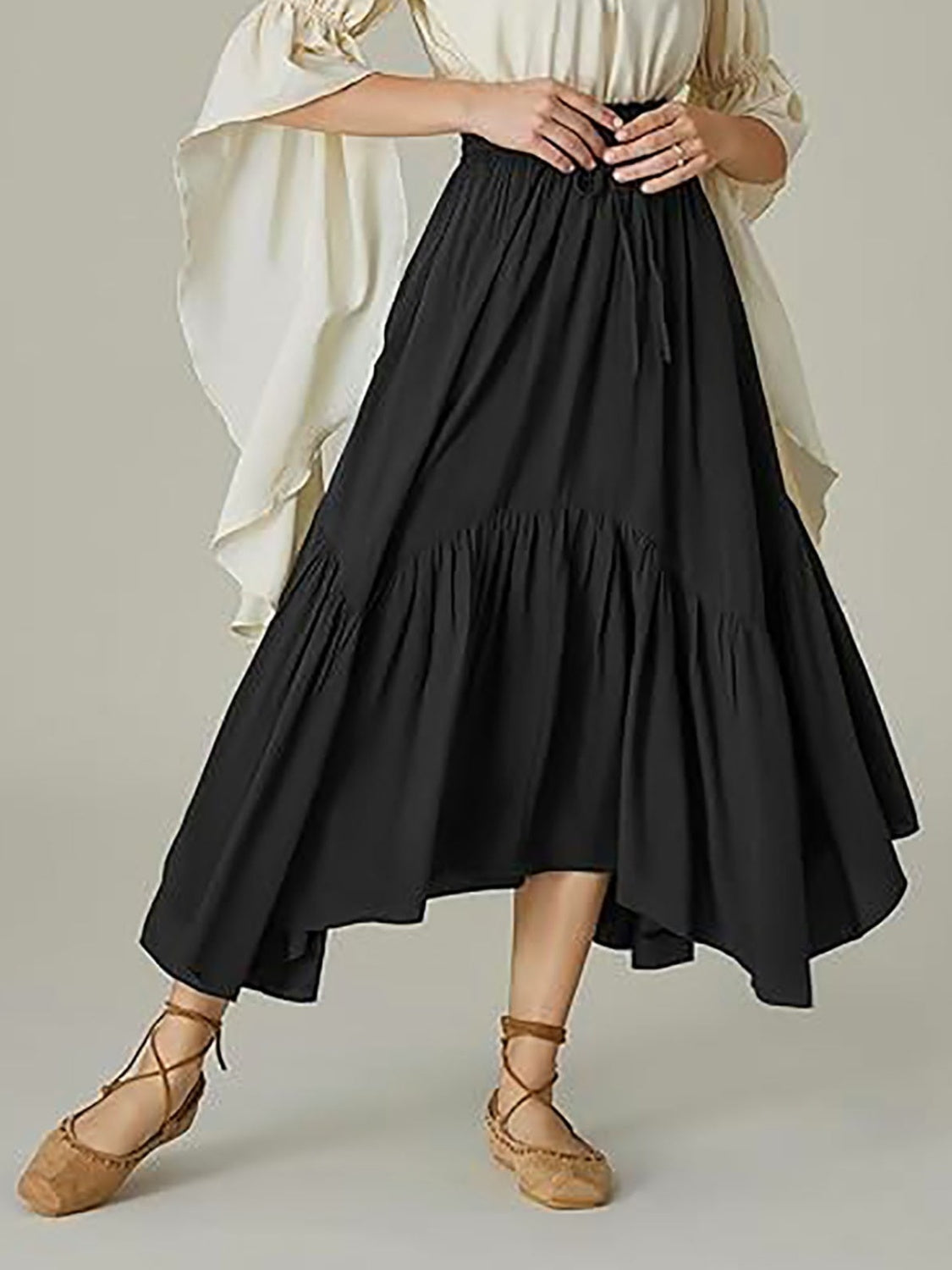 Black tiered midi skirt with asymmetrical hemline and drawstring waist