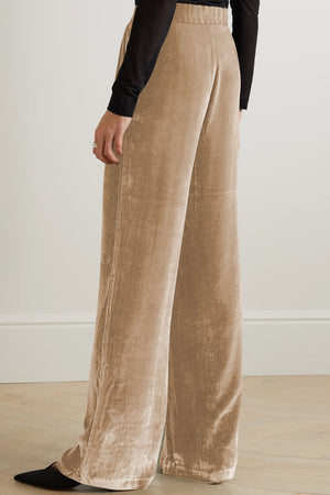 Velvet palazzo trousers in tan with a high waist and wide leg, shown from the side.