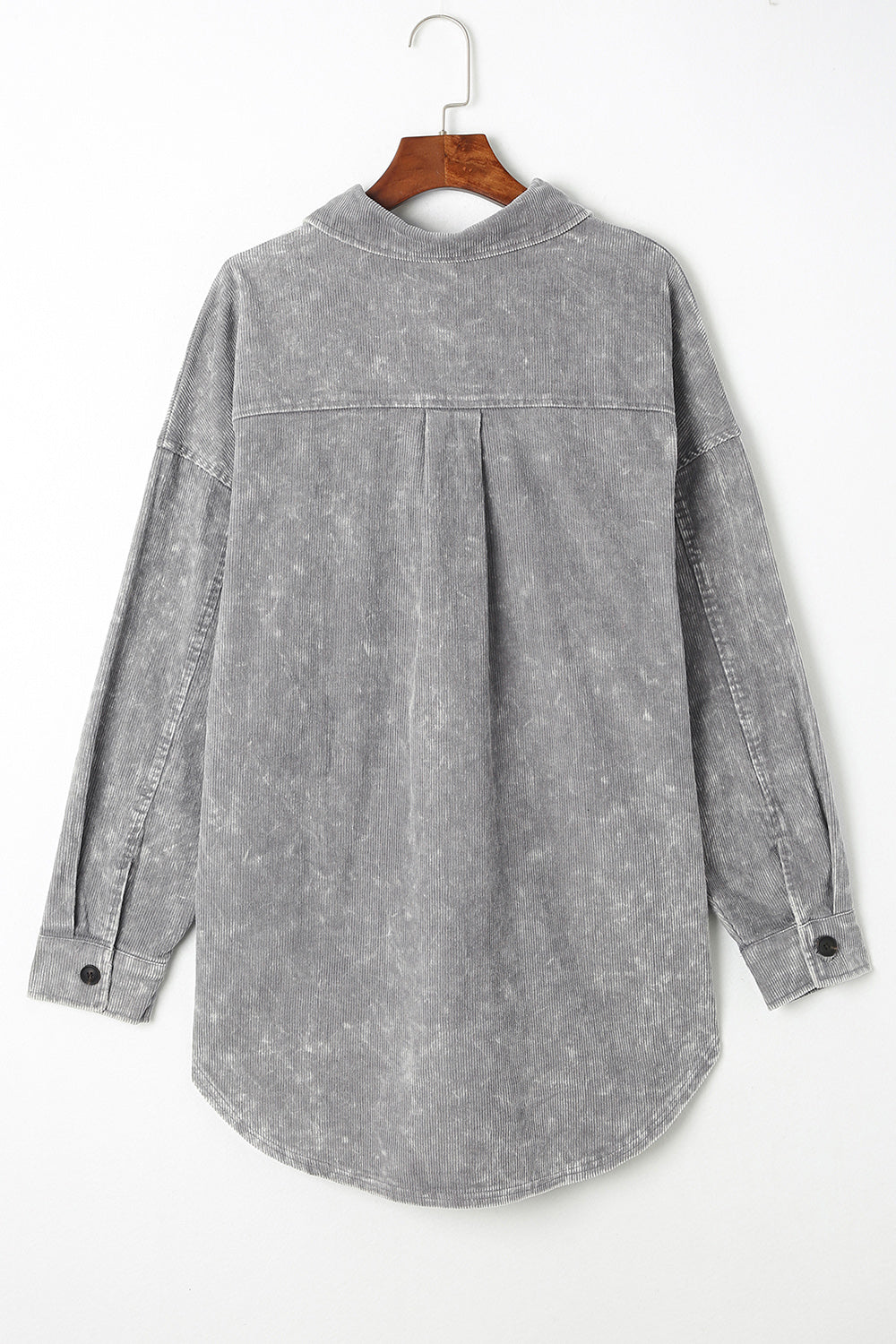 Textured corduroy overshirt in cloudy blue with faded wash and button details.